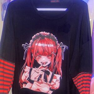 Long-sleeve graphic shirt featuring anime design.